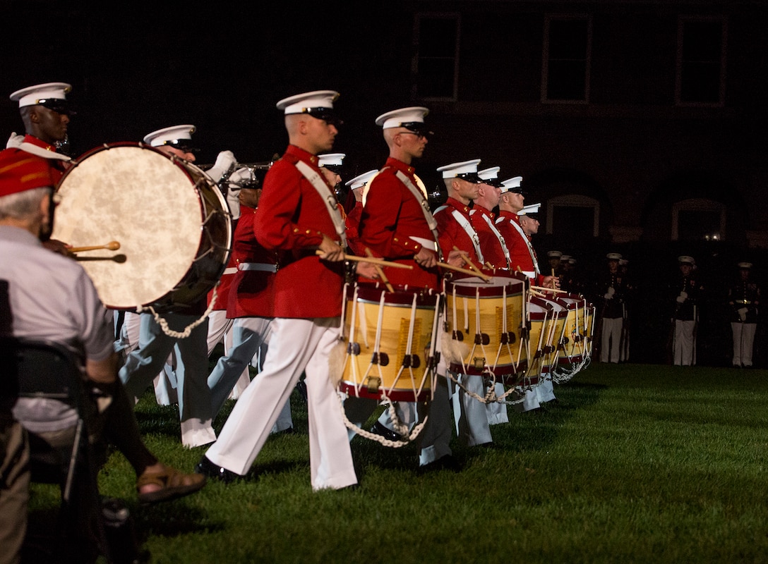 Marines with “The Commandant’s Own” U.S. Marine Drum & Bugle march across the parade deck during a Friday Evening Parade at Marine Barracks Washington D.C., Aug. 18, 2017. The guest of honor for the parade was the Superintendent of the U.S. Naval Academy, Vice Adm. Walter E. Carter, Jr., and the hosting official was the Deputy Commandant, Combat Development and Integration Commanding General, Marine Corps Combat Development Command, Lt. Gen. Robert S. Walsh. (Official Marine Corps photo by Lance Cpl. Damon McLean/Released)