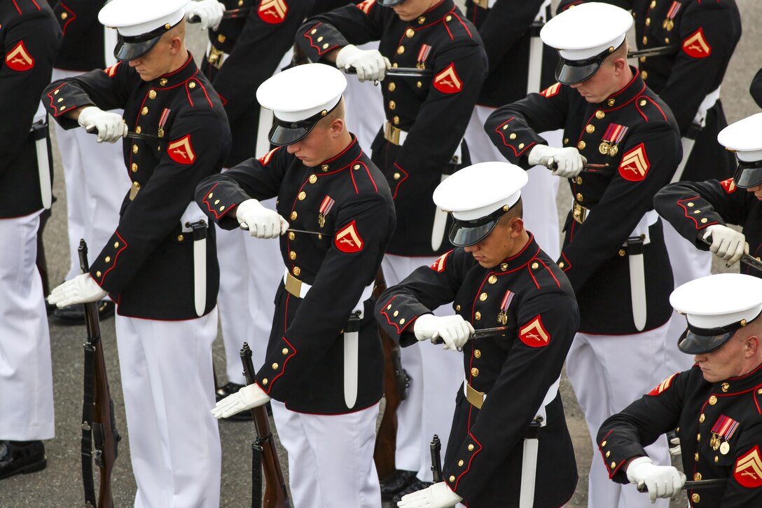 Marines with the U.S. Marine Corps Silent Drill Platoon conduct “fixed bayonets” during a combined ceremony at Kingston, Ontario, Canada, Aug. 19, 2017. This visit marked the anniversary of the Ogdensburg Agreement, which was signed by President Roosevelt and Prime Minister King to bind the two nations in the combined defense of North America. Since then, the two units have paraded together countless times both at the Fort and at Marine Barracks Washington. (Official U.S. Marine Corps photo by Lance Cpl. Damon McLean/Released)