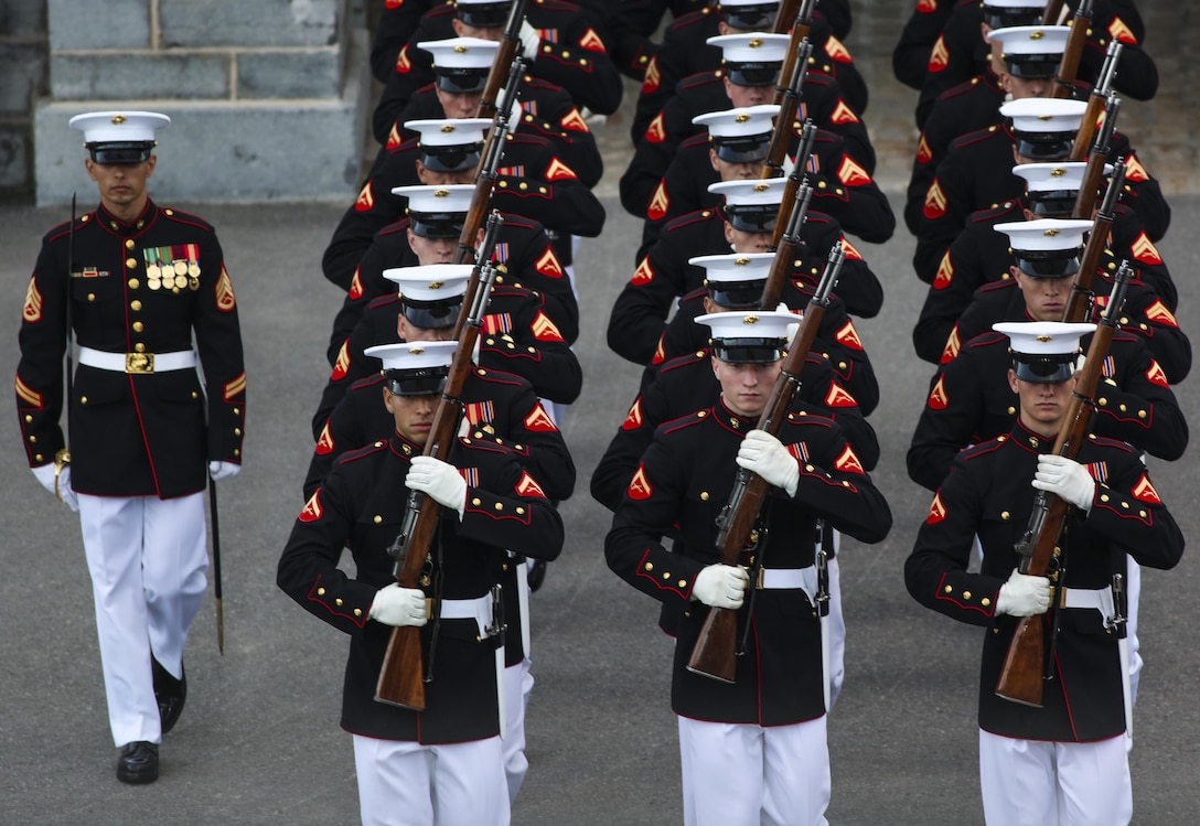 Marines with the U.S. Marine Corps Silent Drill Platoon march onto the parade deck during a combined ceremony at Kingston, Ontario, Canada, Aug. 19, 2017. This visit marked the anniversary of the Ogdensburg Agreement, which was signed by President Roosevelt and Prime Minister King to bind the two nations in the combined defense of North America. Since then, the two units have paraded together countless times both at the Fort and at Marine Barracks Washington. (Official U.S. Marine Corps photo by Lance Cpl. Damon McLean/Released)