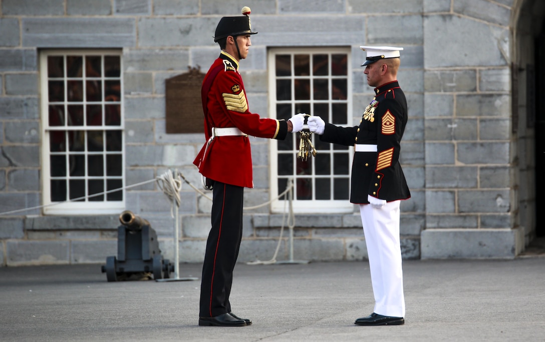 Sergeant Major Matthew R. Hackett, command sergeant major, Marine Barracks Washington D.C., is presented the keys to Fort Henry during a combined ceremony at Kingston, Ontario, Canada, Aug. 19, 2017. This visit marked the anniversary of the Ogdensburg Agreement, which was signed by President Roosevelt and Prime Minister King to bind the two nations in the combined defense of North America. Since then, the two units have paraded together countless times both at the Fort and at Marine Barracks Washington. (Official U.S. Marine Corps photo by Lance Cpl. Damon McLean/Released)