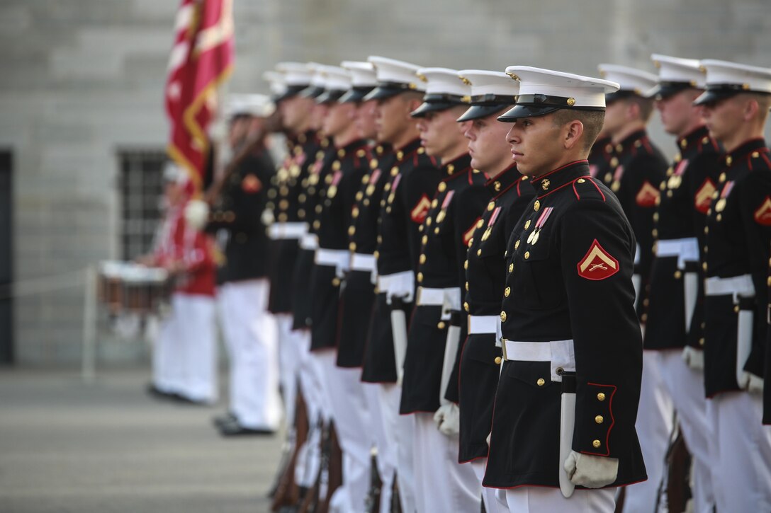 Marines with the U.S. Marine Corps Silent Drill Platoon stand at the position of attention on the parade deck during a combined ceremony at Kingston, Ontario, Canada, Aug. 19, 2017. This visit marked the anniversary of the Ogdensburg Agreement, which was signed by President Roosevelt and Prime Minister King to bind the two nations in the combined defense of North America. Since then, the two units have paraded together countless times both at the Fort and at Marine Barracks Washington. (Official U.S. Marine Corps photo by Lance Cpl. Damon McLean/Released)