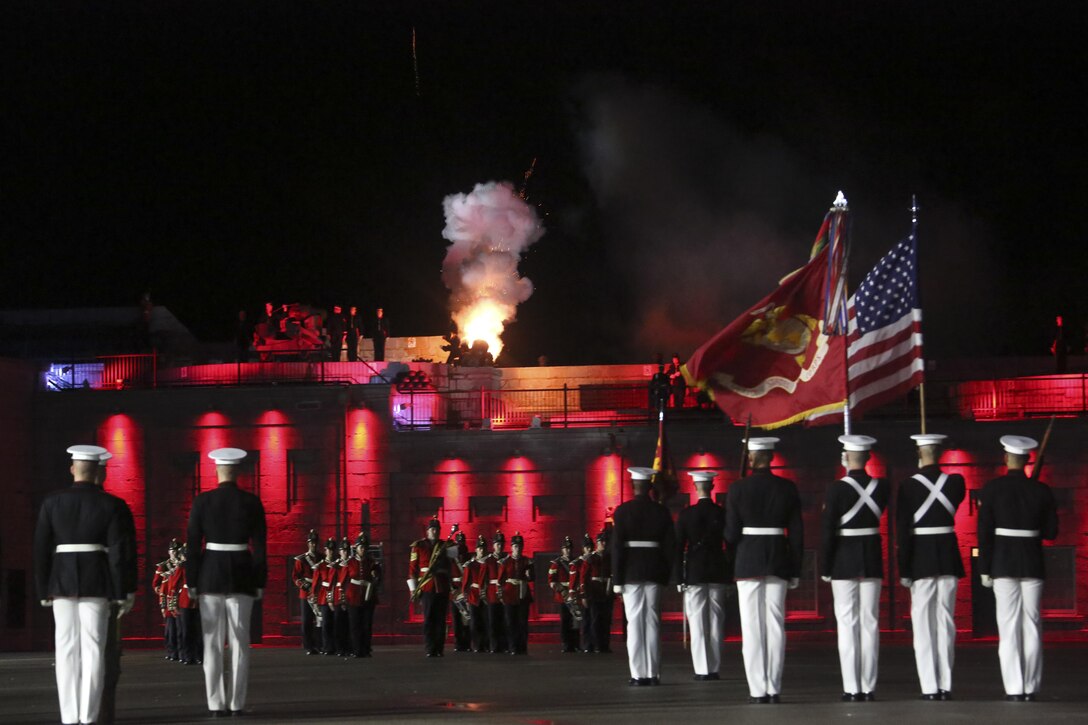 Marines with Marine Barracks Washington D.C. render honors as members of the Fort Henry Guard fire cannons at the closing of a combined ceremony at Kingston, Ontario, Canada, Aug. 19, 2017. This visit marked the anniversary of the Ogdensburg Agreement, which was signed by President Roosevelt and Prime Minister King to bind the two nations in the combined defense of North America. Since then, the two units have paraded together countless times both at the Fort and at Marine Barracks Washington. Sgt. Brandon T. Webb, mascot handler, escorts Corporal Chesty XIV, official Marine Corps mascot, during a combined ceremony at Kingston, Ontario, Canada, Aug. 19, 2017. This visit marked the anniversary of the Ogdensburg Agreement, which was signed by President Roosevelt and Prime Minister King to bind the two nations in the combined defense of North America. Since then, the two units have paraded together countless times both at the Fort and at Marine Barracks Washington. (Official U.S. Marine Corps photo by Lance Cpl. Damon McLean/Released)