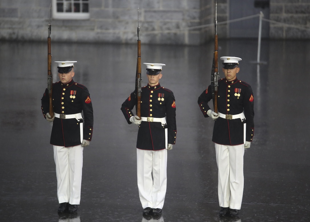 Marines with the U.S. Marine Corps Silent Drill Platoon execute precision drill movements during a combined ceremony at Kingston, Ontario, Canada, Aug. 19, 2017. This visit marked the anniversary of the Ogdensburg Agreement, which was signed by President Roosevelt and Prime Minister King to bind the two nations in the combined defense of North America. Since then, the two units have paraded together countless times both at the Fort and at Marine Barracks Washington. (Official U.S. Marine Corps photo by Lance Cpl. Damon McLean/Released)