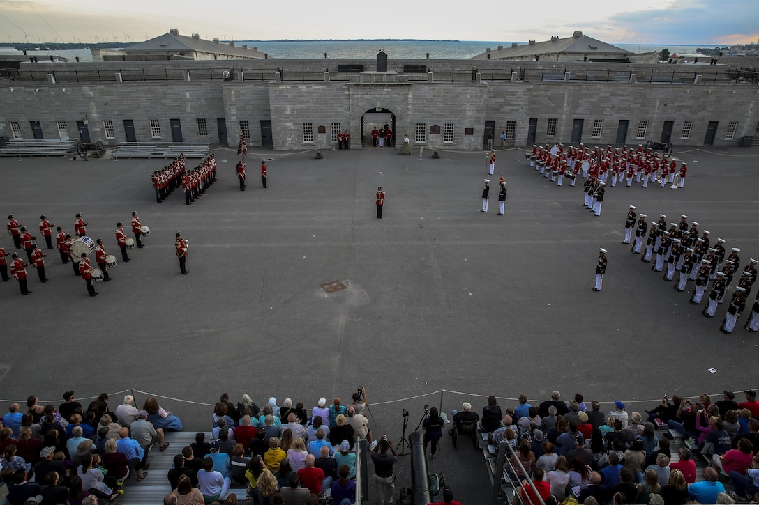 Marines with the U.S. Marine Corps Battle Color Detachment perform alongside members of the Fort Henry Guard at Kingston, Ontario, Canada, Aug. 19, 2017. This visit marked the anniversary of the Ogdensburg Agreement, which was signed by President Roosevelt and Prime Minister King to bind the two nations in the combined defense of North America. Since then, the two units have paraded together countless times both at the Fort and at Marine Barracks Washington. (Official U.S. Marine Corps photo by Lance Cpl. Damon McLean/Released)