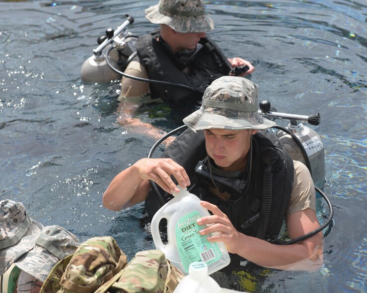 A U.S. Air Force dive school student hydrates during a training session at the Naval Diving and Salvage Training Center within Naval Support Activity Panama City, Fla., Aug. 2, 2017. The center is the Department of Defense's largest dive school, and trains members of all five military branches.