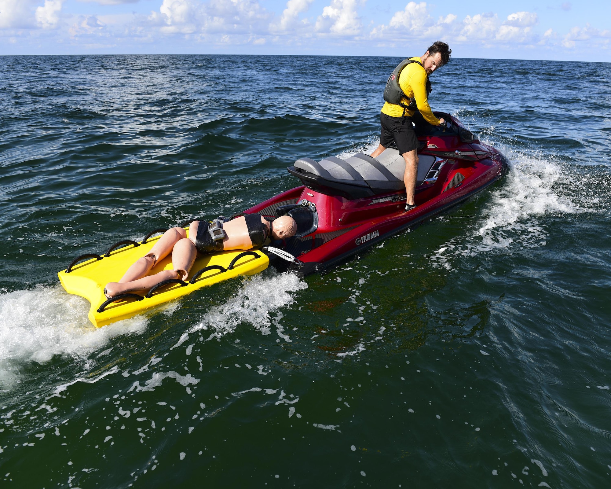 A Naval Diving and Salvage Training Center instructor transports a mannequin for a recovery exercise in the Gulf of Mexico, Aug. 15, 2017. The exercise involved dropping mannequins and ruck sacks to the bottom of the Gulf and the students pulling them out to simulate an underwater recovery mission.