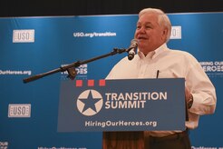 North Charleston Mayor Keith Summey speaks to the audience attending the Hiring Our Heroes transition summit at the Charleston Club in Joint Base Charleston, S.C., Aug. 22.