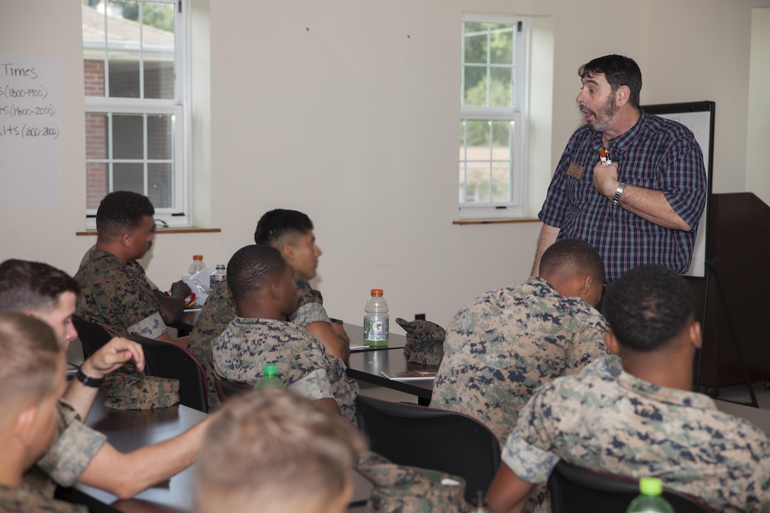 The motor transport unit, Marine Raider Support Group, U.S. Marine Corps Forces, Special Operation Command, participate in an interactive Peer 2 Peer exercise during a Four Lenses Temperament Discovery class at Stone Bay, Marine Corps Base Camp Lejeune, N.C., Aug. 18, 2017.  Over 30 Marines from MRSG’s motor transportation unit attend the 2-hour class on understanding the four main communication styles in their personal and professional lives. (U.S. Marine Corps photo by LCpl. Bryann K. Whitley)