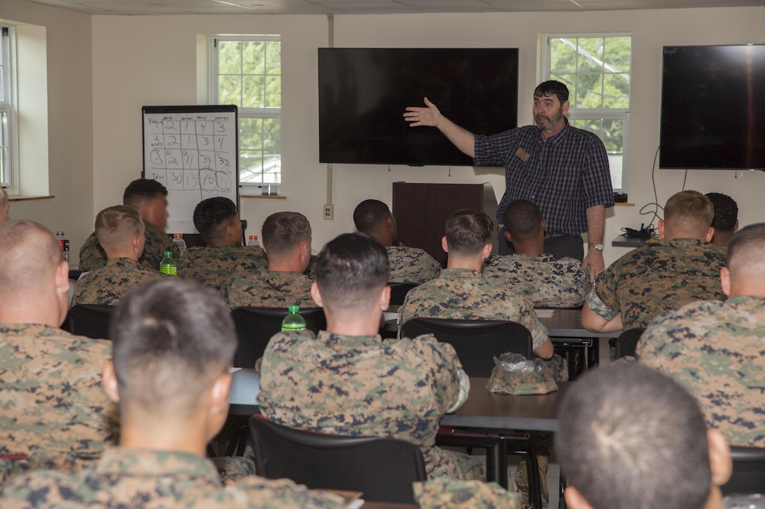 The motor transport unit, Marine Raider Support Group, U.S. Marine Corps Forces, Special Operation Command, participate in an interactive Peer 2 Peer exercise during a Four Lenses Temperament Discovery class at Stone Bay, Marine Corps Base Camp Lejeune, N.C., Aug. 18, 2017.  Over 30 Marines from MRSG’s motor transportation unit attend the 2-hour class on understanding the four main communication styles in their personal and professional lives. (U.S. Marine Corps photo by LCpl. Bryann K. Whitley)
