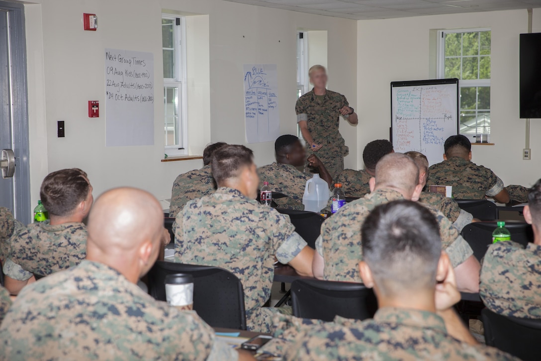 The motor transport unit, Marine Raider Support Group, U.S. Marine Corps Forces, Special Operation Command, participate in an interactive Peer 2 Peer exercise during a Four Lenses Temperament Discovery class at Stone Bay, Marine Corps Base Camp Lejeune, N.C., Aug. 18, 2017.  Over 30 Marines from MRSG’s motor transportation unit attend the 2-hour class on understanding the four main communication styles in their personal and professional lives. (U.S. Marine Corps photo by LCpl. Bryann K. Whitley)