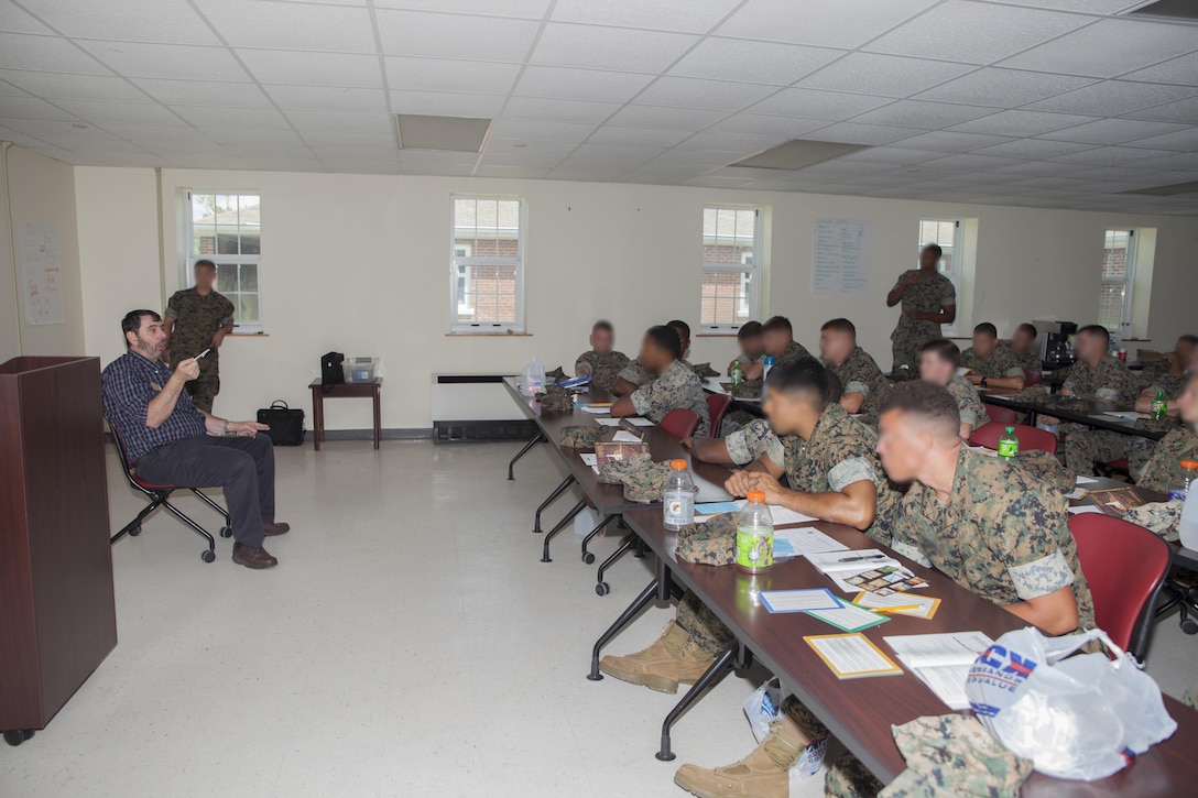 The motor transport unit, Marine Raider Support Group, U.S. Marine Corps Forces, Special Operation Command, participate in an interactive Peer 2 Peer exercise during a Four Lenses Temperament Discovery class at Stone Bay, Marine Corps Base Camp Lejeune, N.C., Aug. 18, 2017.  Over 30 Marines from MRSG’s motor transportation unit attend the 2-hour class on understanding the four main communication styles in their personal and professional lives. (U.S. Marine Corps photo by LCpl. Bryann K. Whitley)