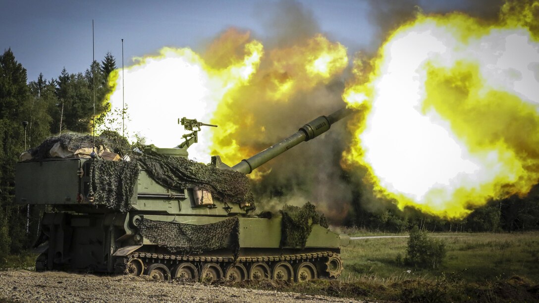 Soldiers fire an M109A6 Paladin howitzer during training.