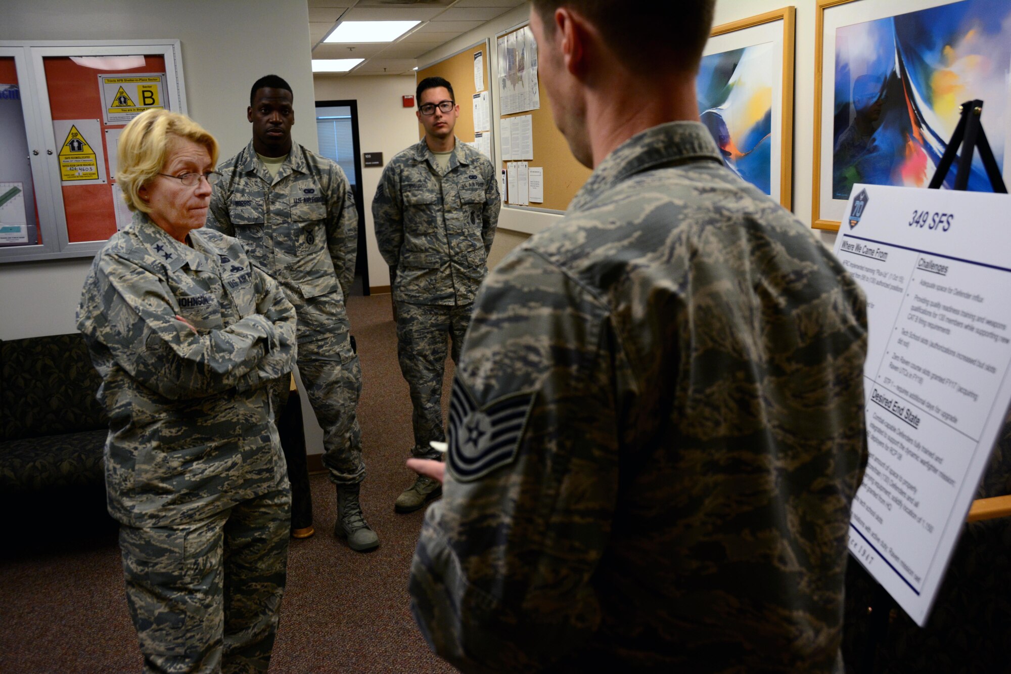 Maj. Gen. Kathryn Johnson, director of logistics, Air Force Reserve Command, speaks with 349th Security Forces Squadron members, at Travis Air Force Base, Calif., on Aug. 13, 2017.