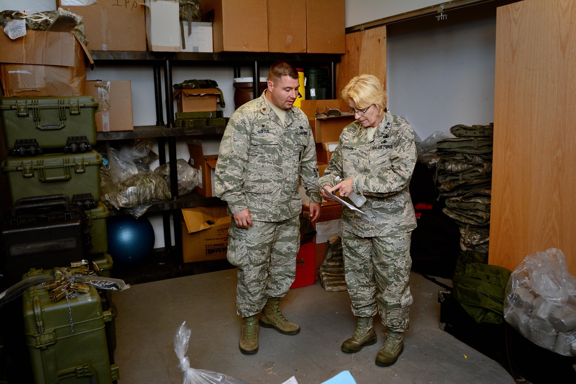 Maj. Gen. Kathryn Johnson, director of logistics, Air Force Reserve Command, speaks with Maj. Brian Loftus, 349th Security Forces Squadron commander, at Travis Air Force Base, Calif., on Aug. 13, 2017.