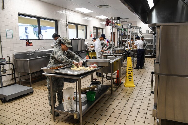 Airmen with the 2nd Force Support Squadron prepare dishes during an advanced culinary skills course graduation at the Red River Dining Facility at Barksdale Air Force Base, La., Aug. 18, 2017. Students received training on advanced cooking skills, the history of different foods and culinary styles.