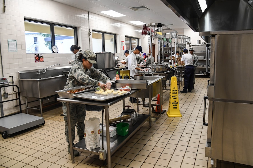 Airmen with the 2nd Force Support Squadron prepare dishes during an advanced culinary skills course graduation at the Red River Dining Facility at Barksdale Air Force Base, La., Aug. 18, 2017. Students received training on advanced cooking skills, the history of different foods and culinary styles.