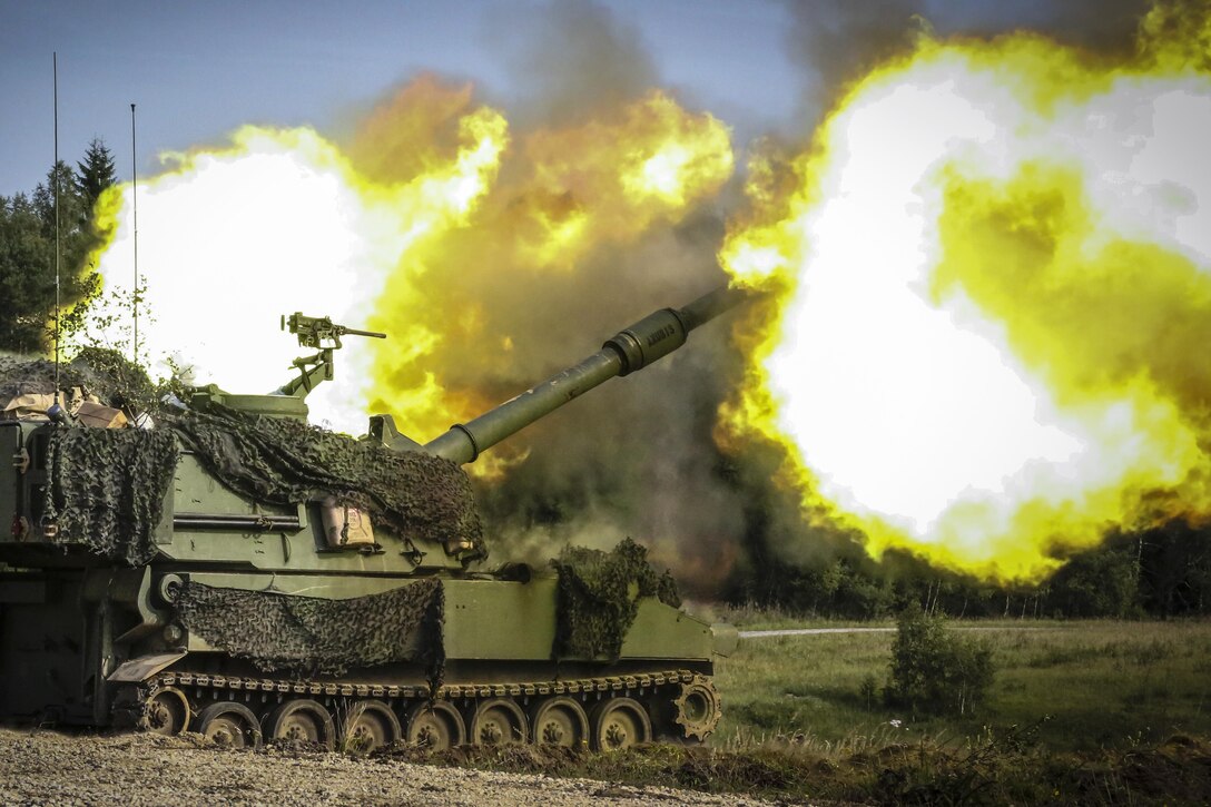 Soldiers fire an M109A6 Paladin howitzer during training.