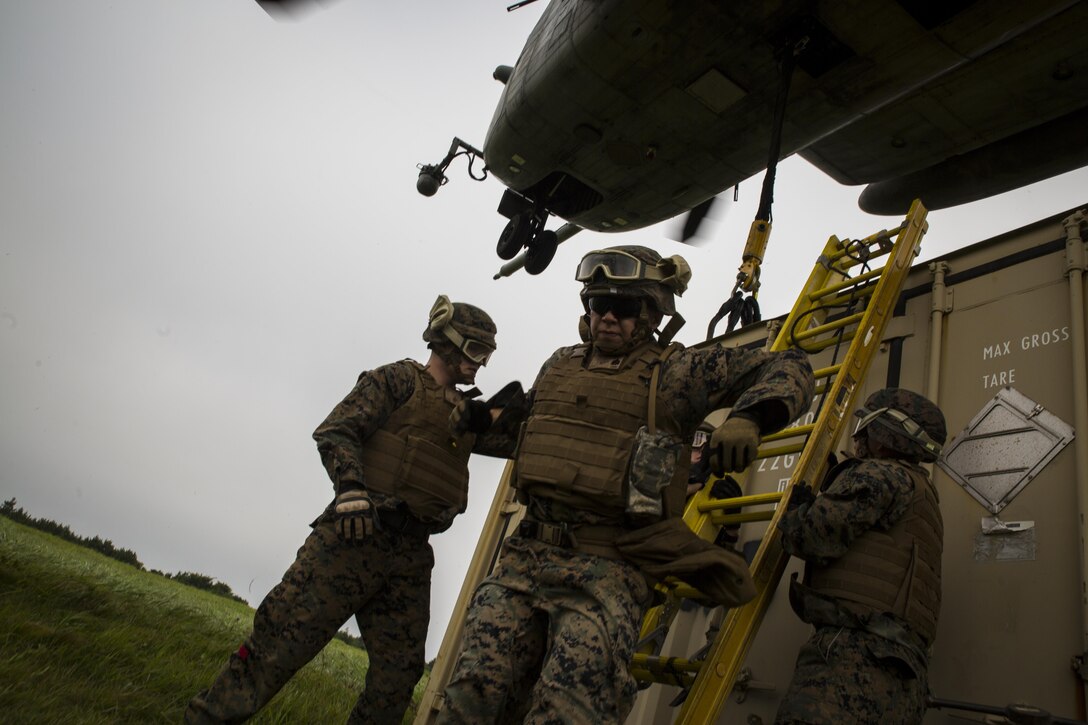 Sgt. Mitchell Castner, a landing support specialist, climbs down a ladder during external lift training at Draughon Range near Misawa Air Base, Japan, August 21, 2017, in support of exercise Northern Viper 17. This combined-joint exercise is held to enhance regional cooperation between participating nations to collectively deter security threats. Castner, a native of Eatontown, New Jersey, is assigned to Combat Logistics Battalion 4, Combat Logistics Regiment 3, 3rd Marine Logistic Group. (U.S. Marine Corps photo by Lance Cpl. Andy Martinez)