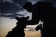 Senior Airman Ryne Wilson, 99th Security Forces Squadron military working dog handler, praises MWD Habo during a patrol at Nellis Air Force Base, Nevada, August 7, 2017. Praising their dog for exhibiting good behavior is an exceptional way to help build a bond between the handler and their dog. (U.S. Air Force photo by Airman 1st Class Andrew D. Sarver/Released)
