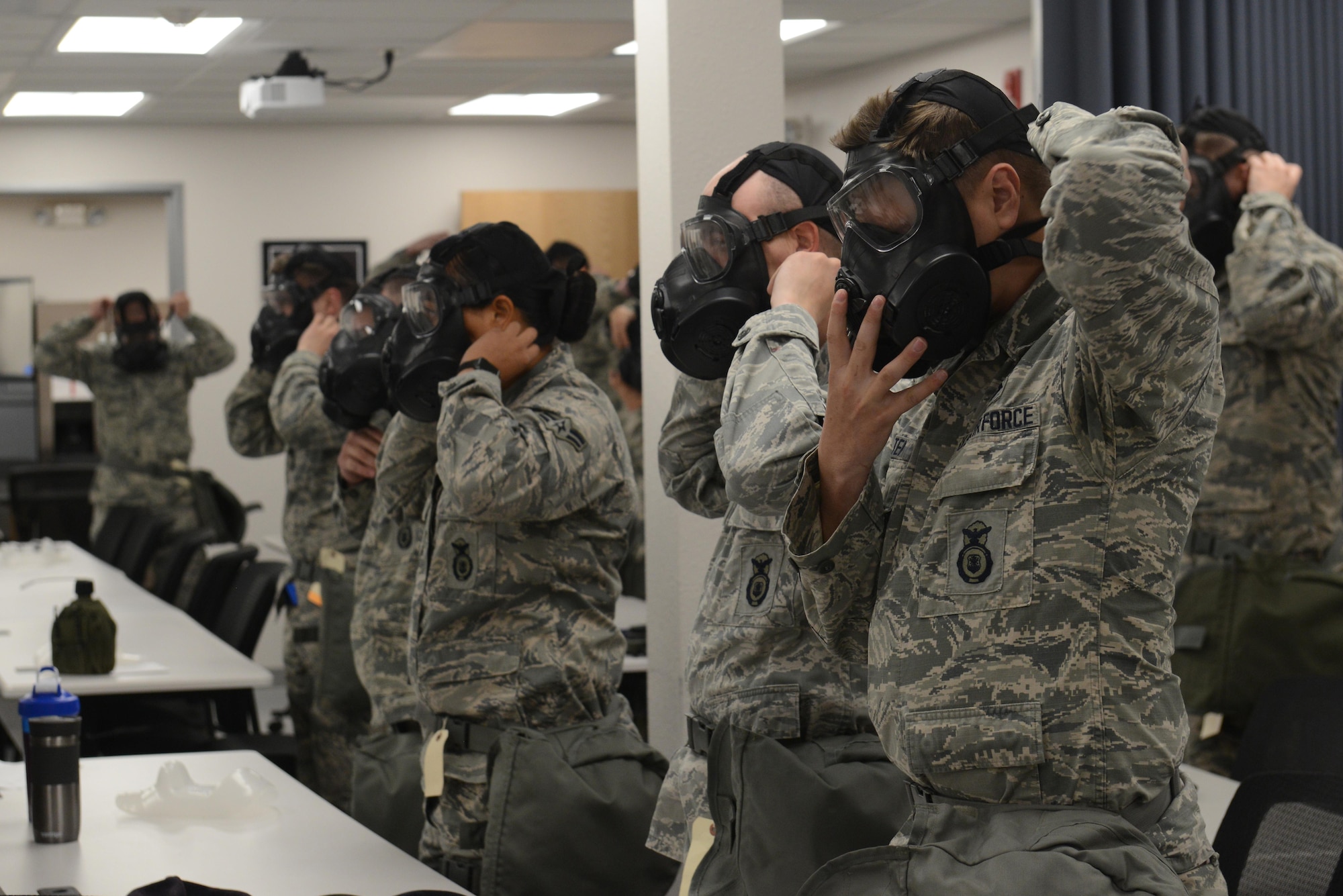 Airmen practice donning their gas mask within nine seconds during a Chemical, Biological, Radiological, and Nuclear defense survival skills training class hosted by the 773d Civil Engineer Squadron emergency management flight at Joint Base Elmendorf-Richardson, Alaska, Aug. 22. The two-hour CBRN class reminds Airmen of the various equipment and proper procedures used pre- and post-attack, and puts the Airmen’s knowledge to the test with an application of this information in full Mission Oriented Protected Posture gear.