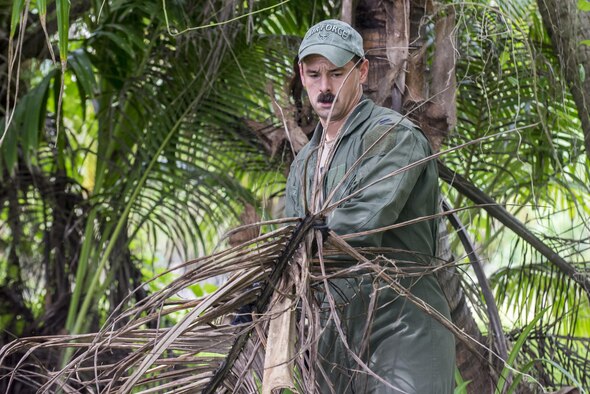 U.S. Air Force 1st Lt. Manuel Lamson, 9th Expeditionary Bomb Squadron weapon systems officer, gathers dried palm frond during a jungle survival course July 27, 2017, at Andersen Air Force Base, Guam. During the course, Airmen were trained on how to build fires, identify edible plants and animals, erect shelters and how to contact friendly forces while isolated. (U.S. Air Force photo by Airman 1st Class Christopher Quail)