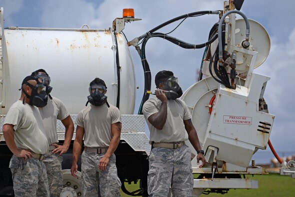 A U.S. Airman assigned to the 36th Civil Engineer Squadron operates a radio during a training exercise Aug. 17, 2017, at Andersen Air Force Base, Guam. Airmen that participated in Prime BEEF (Base Engineer Emergency Force) Day practiced accomplishing tasks while in Mission-Oriented Protective Posture (MOPP) gear.  (U.S. Air Force photo/Airman 1st Class Gerald R. Willis)