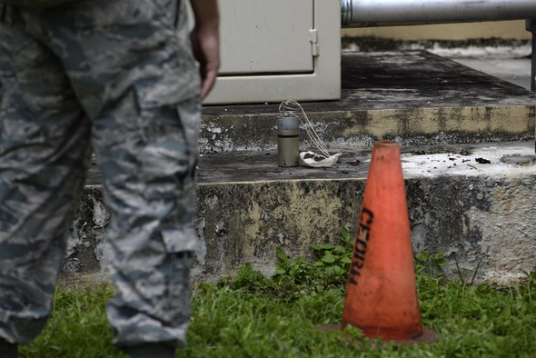 An Airman assigned to the 36th Civil Engineer Squadron identifies an unexploded ordinance during a training exercise Aug. 17, 2017, at Andersen Air Force Base, Guam. This training, known as Prime BEEF (Base Engineer Emergency Force) Day, allowed Airmen to train in dealing with various unexploded ordinances safely in a controlled training environment. (U.S. Air Force photo/Airman 1st Class Gerald R. Willis)