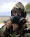 U.S. Air Force Tech. Sgt. Cris Ocampo, 36th Civil Engineer Squadron construction management NCO in charge, dons a M50 gas mask during a training exercise Aug. 17, 2017, at Andersen Air Force Base, Guam. During this Prime BEEF (Base Engineer Emergency Force) Day, Airmen focused on performing recovery tasks in a chemical, biological, radiological and nuclear environment. (U.S. Air Force photo/Airman 1st Class Gerald R. Willis)
