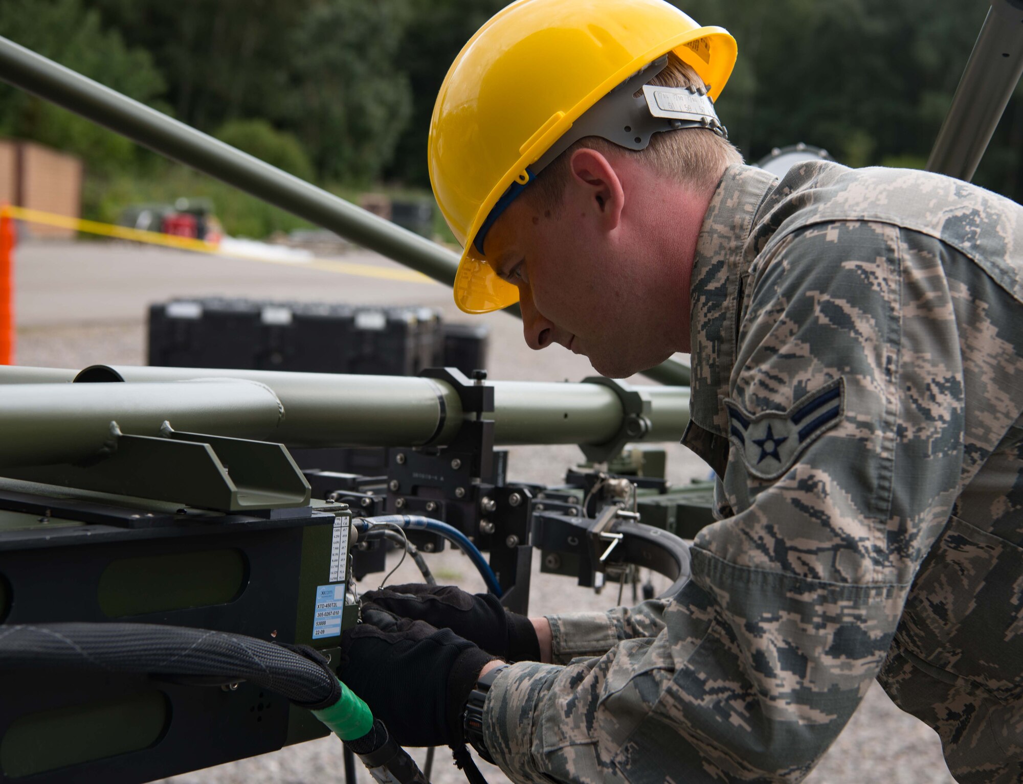 U.S. Air Force Airman 1st Class John Fitzpatrick, 1st Combat Communications Squadron radio frequency technician, assembles a small aperture antenna on Ramstein Air Base, Germany, Aug. 21, 2017.