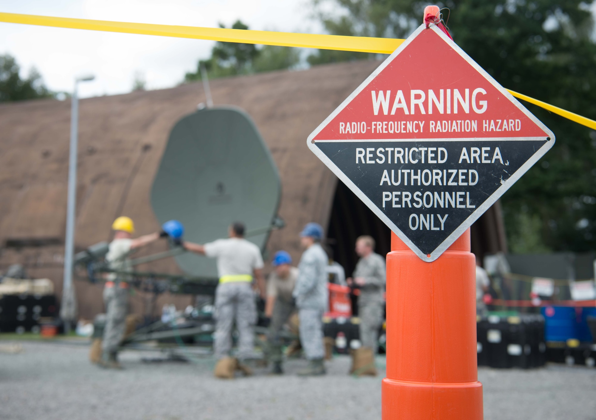 An area is cordoned off due to radiation hazards as U.S. Airmen prepare an antenna to transmit during Exercise Lending Hand on Ramstein Air Base, Germany, Aug. 21, 2017.