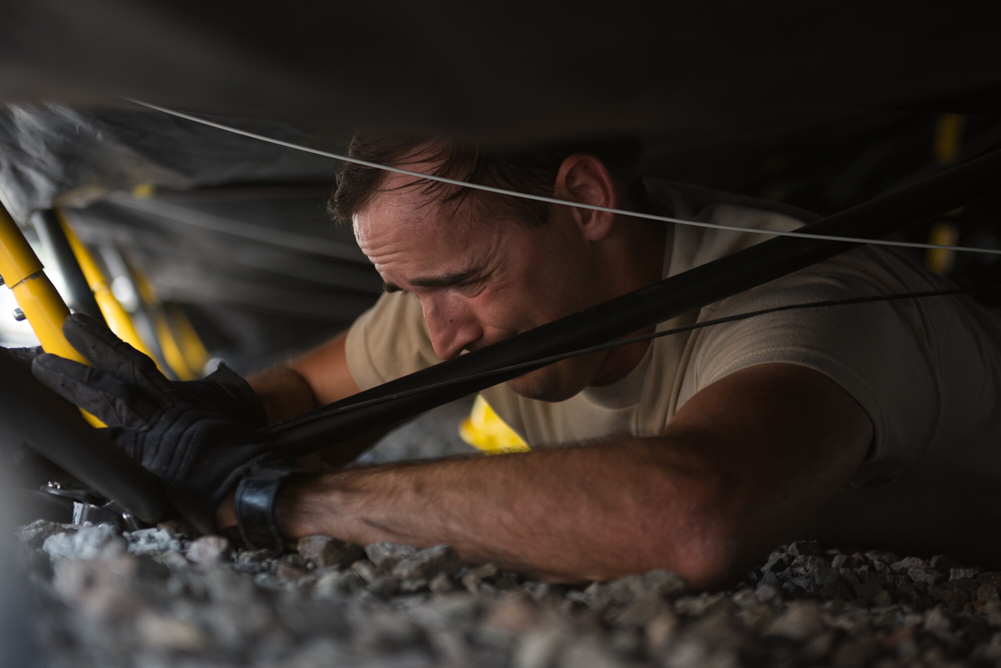 A U.S. Airman assigned to the 1st Combat Communications Squadron replaces a tent pole during Exercise Lending Hand on Ramstein Air Base, Germany, Aug. 21, 2017.