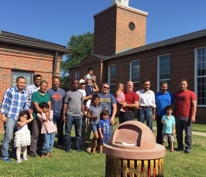 Families pose for a picture to commemorate the fun and fellowship held at the Muslim cookout held Aug. 19.