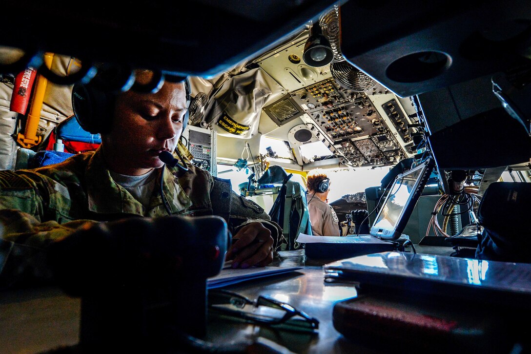 An Air Force airman reviews refueling documents.