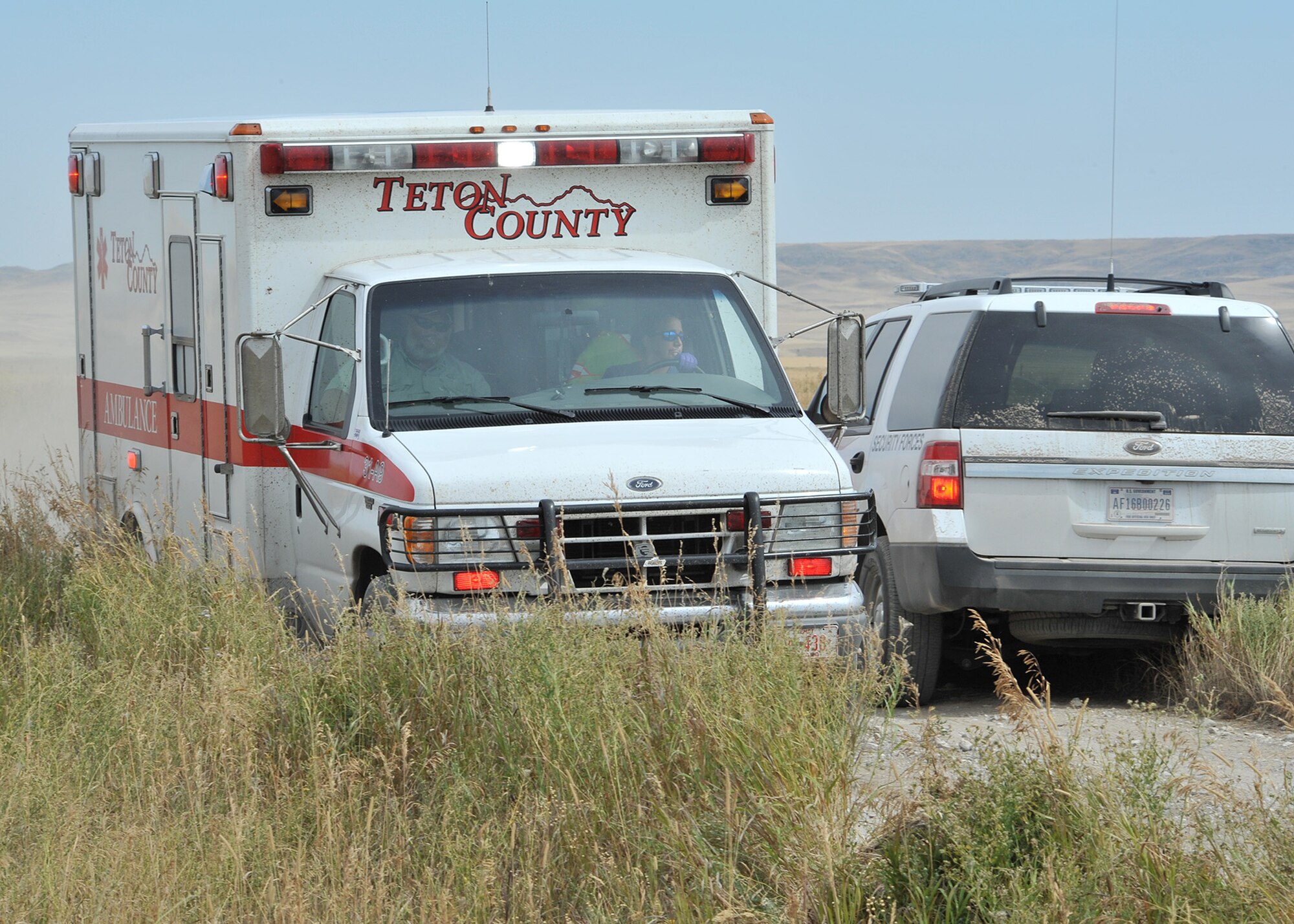 An ambulance from Teton County Emergency Medical Services is processed onto the scene of a mock attack on an Air Force convoy to treat simulated casualties during a Local Integrated Response Plan exercise Aug. 16, 2017 near Choteau, Mont.