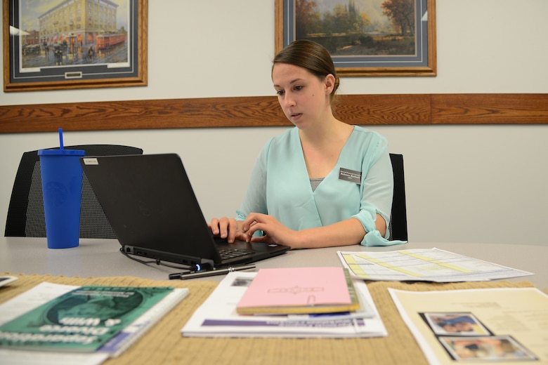 Rebecca Burbach, Malmstrom personal financial counselor, fills in a spending plan financial worksheet for a customer Aug. 21, 2017, at Malmstrom Air Force Base, Mont.
