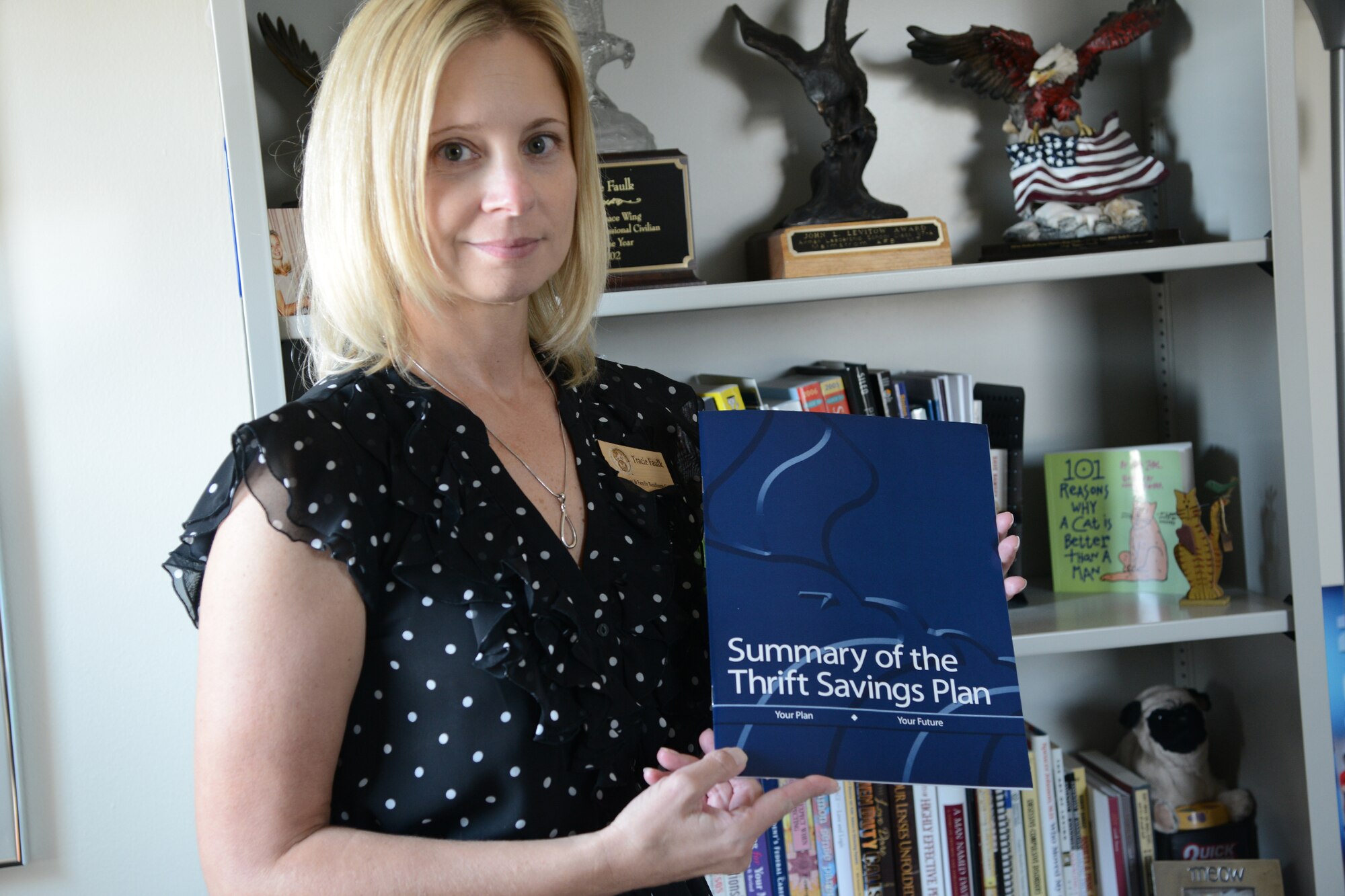 Tracie Faulk, 341st Force Support Squadron Airmen and Family Readiness Center community readiness consultant, displays a summary of the Thrift Savings Plan Aug. 21, 2017, at Malmstrom Air Force Base, Mont.