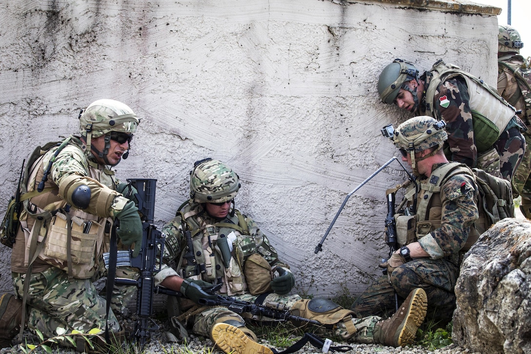 Marines assess a simulated casualty.