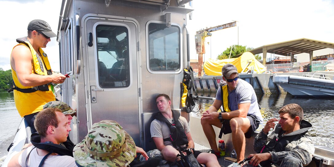 Naval Diving and Salvage Training Center instructors and Air Force students hold a peer discussion.