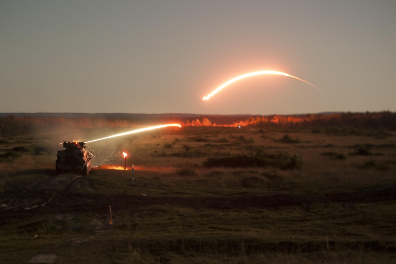 A Ukrainian armored personnel carrier from the 1st Battalion, 95th Separate Airmobile Brigade fires tracer rounds.