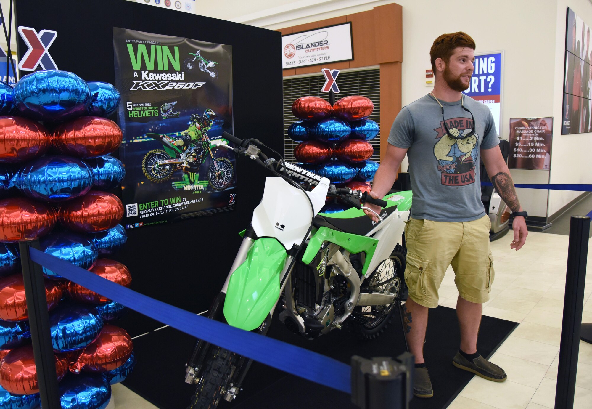 U.S. Army Spc. Anthony Clark, Alpha Company 1-155th infantryman, Mississippi National Guard, Biloxi, Miss., delivers remarks after winning a Kawasaki KXTM250F motorcycle at the Base Exchange, Aug. 19, 2017, on Keesler Air Force Base, Miss. Clark, a Biloxi native, was randomly selected from more than 16,000 entries to win the Army & Air Force Exchange Service’s Monster Kawasaki Sweepstakes, which ran from April 15 to May 31. (U.S. Air Force photo by Kemberly Groue)