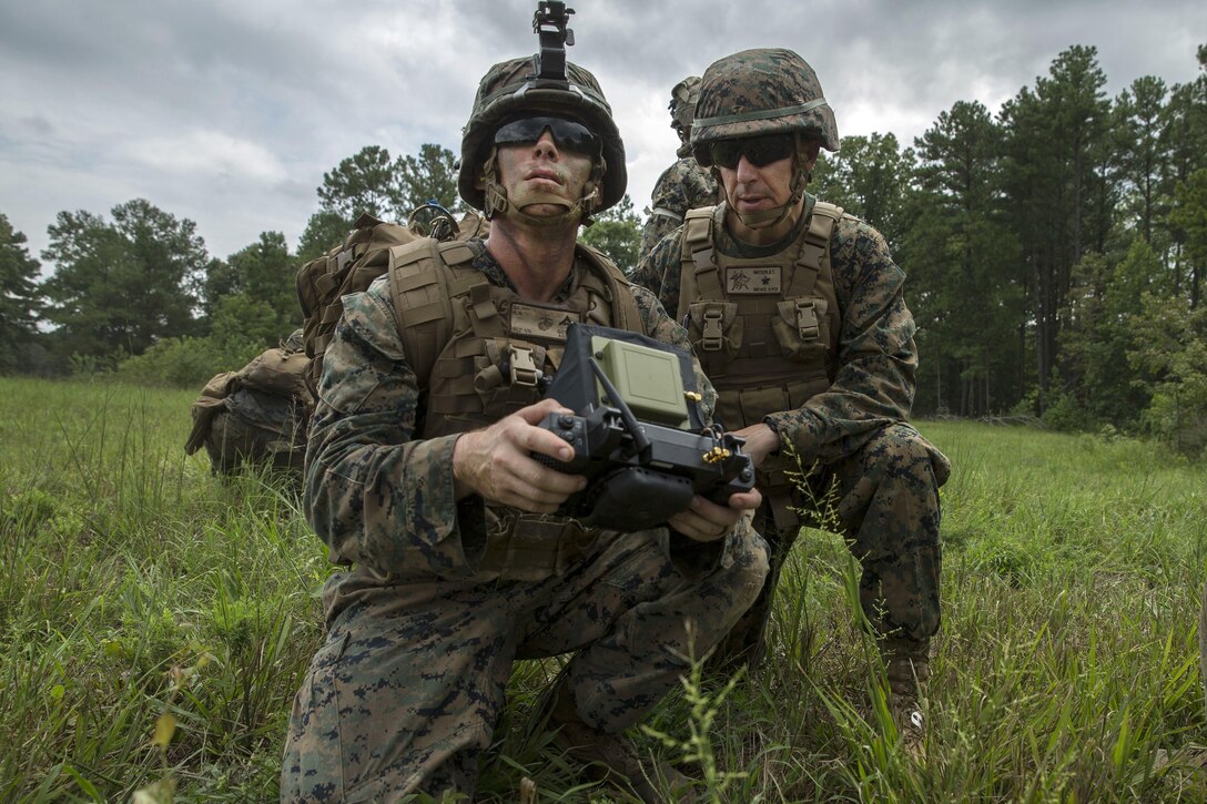 A Marine demonstrates a surveillance device.