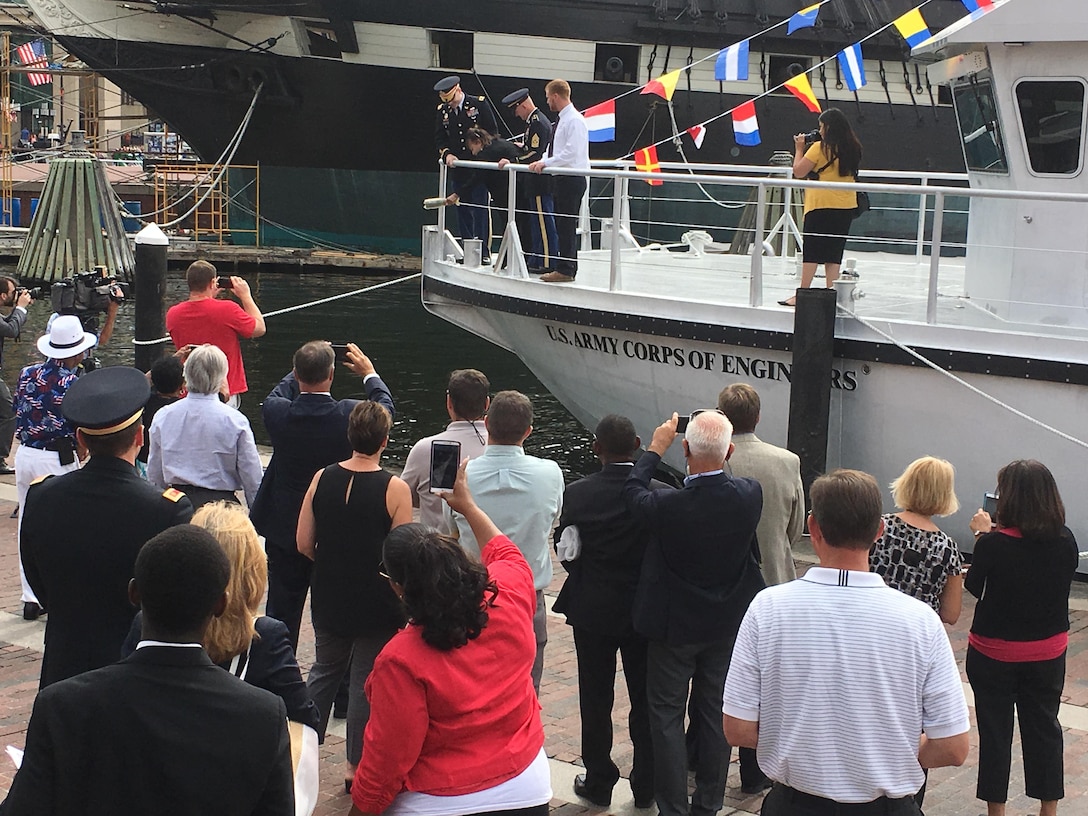 Angela Leone, with U.S. Army Corps of Engineers, Baltimore District, Commander Col. Ed. Chamberlayne, U.S. Army Corps of Engineers, Headquarters, Command Sgt. Maj. Bradley Houston and Survey Vessel CATLETT Captain Ryan Schuman, prepares to christen Survey Vessel CATLETT during a ceremony in Baltimore’s Inner Harbor Thursday morning August 24, 2017. The hydrographic survey vessel is the newest vessel in Baltimore District’s fleet and is named for Leone’s brother, the late Harold Catlett who served as a hydrographic surveyor with Baltimore District for roughly 30 years before his sudden passing in 2014.