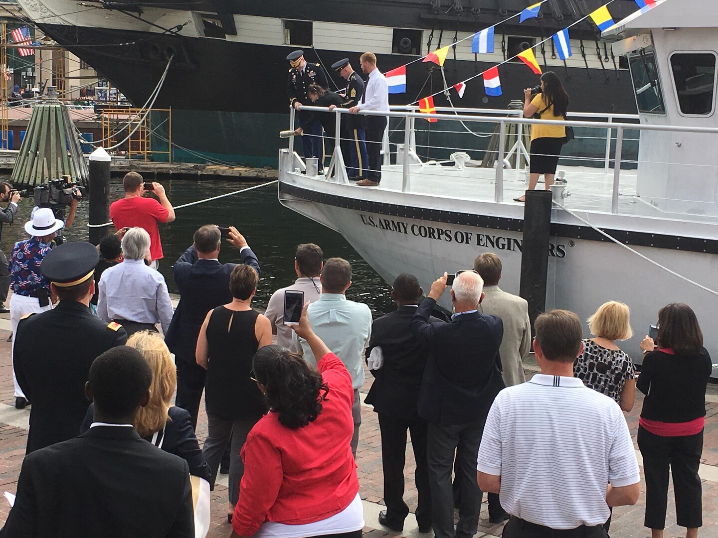 Angela Leone, with U.S. Army Corps of Engineers, Baltimore District, Commander Col. Ed. Chamberlayne, U.S. Army Corps of Engineers, Headquarters, Command Sgt. Maj. Bradley Houston and Survey Vessel CATLETT Captain Ryan Schuman, prepares to christen Survey Vessel CATLETT during a ceremony in Baltimore’s Inner Harbor Thursday morning August 24, 2017. The hydrographic survey vessel is the newest vessel in Baltimore District’s fleet and is named for Leone’s brother, the late Harold Catlett who served as a hydrographic surveyor with Baltimore District for roughly 30 years before his sudden passing in 2014.
