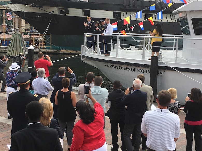 Angela Leone, with U.S. Army Corps of Engineers, Baltimore District, Commander Col. Ed. Chamberlayne, U.S. Army Corps of Engineers, Headquarters, Command Sgt. Maj. Bradley Houston and Survey Vessel CATLETT Captain Ryan Schuman, prepares to christen Survey Vessel CATLETT during a ceremony in Baltimore’s Inner Harbor Thursday morning August 24, 2017. The hydrographic survey vessel is the newest vessel in Baltimore District’s fleet and is named for Leone’s brother, the late Harold Catlett who served as a hydrographic surveyor with Baltimore District for roughly 30 years before his sudden passing in 2014.