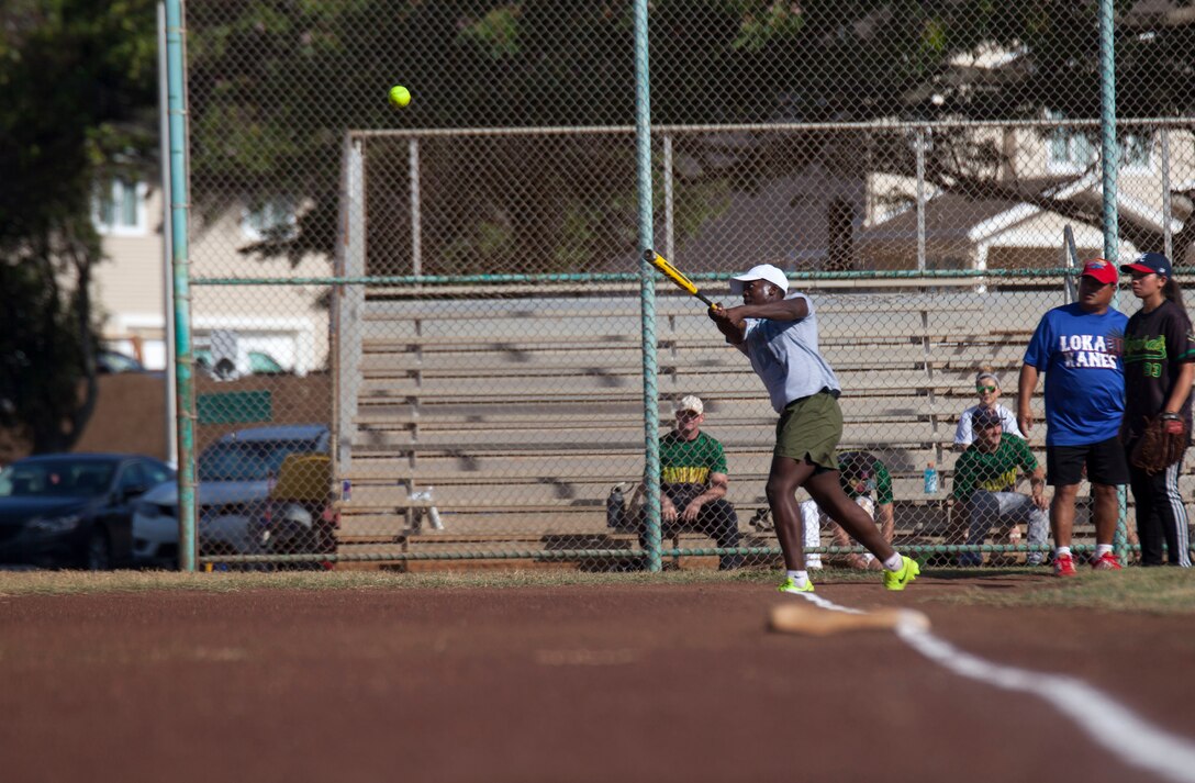 Pfc. Tyree Whitfield, an intelligence specialist with 3rd Marine Regiment, hits a soft-ball during the Marine Corps Community Services’ softball tournament at Riseley Field aboard Marine Corps Base Hawaii on Aug. 19, 2017. The tournament was a continuation of Semper Fit’s “101 Days of Summer” program, which involves various activities that promote team building, overall fitness and well-being, with 3rd Marines winning the tournament. (U.S. Marine Corps photo by Lance Cpl. Matthew Kirk)