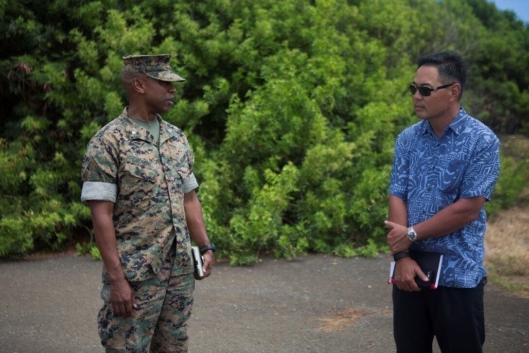 Lt. Col. Gregory Joseph, the executive officer of 3rd Marine Regiment, speaks to Nick Ikeda, the military legislative assistant to U.S. Senator Mazie Hirono, at Boondocker Training Area during a base tour aboard Marine Corps Base Hawaii (MCBH), August 22, 2017. The tour allowed Ikeda to better understand various topics such as MCBH projecting power, producing readiness, promoting resilience; and to discuss the capabilities and readiness of aviation units aboard the installation. (U.S. Marine Corps photo by Cpl. Zachary Orr)