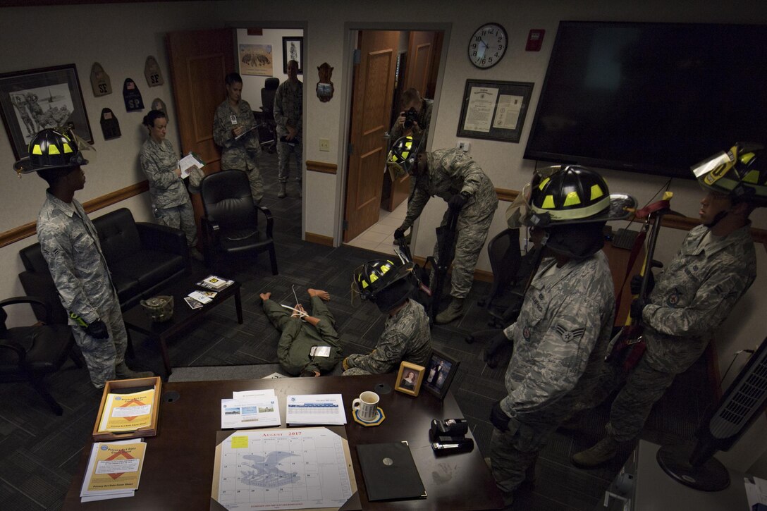 Firefighters respond during an emergency response exercise while members of the 23d Wing Inspection Team observe, Aug. 22, 2017, at Moody Air Force Base, Ga. The purpose of this active-shooter exercise was to inspect the recovery phase of an emergency situation while maintaining realism as members still responded as normal. (U.S. Air Force photo by Airman 1st Class Daniel Snider)