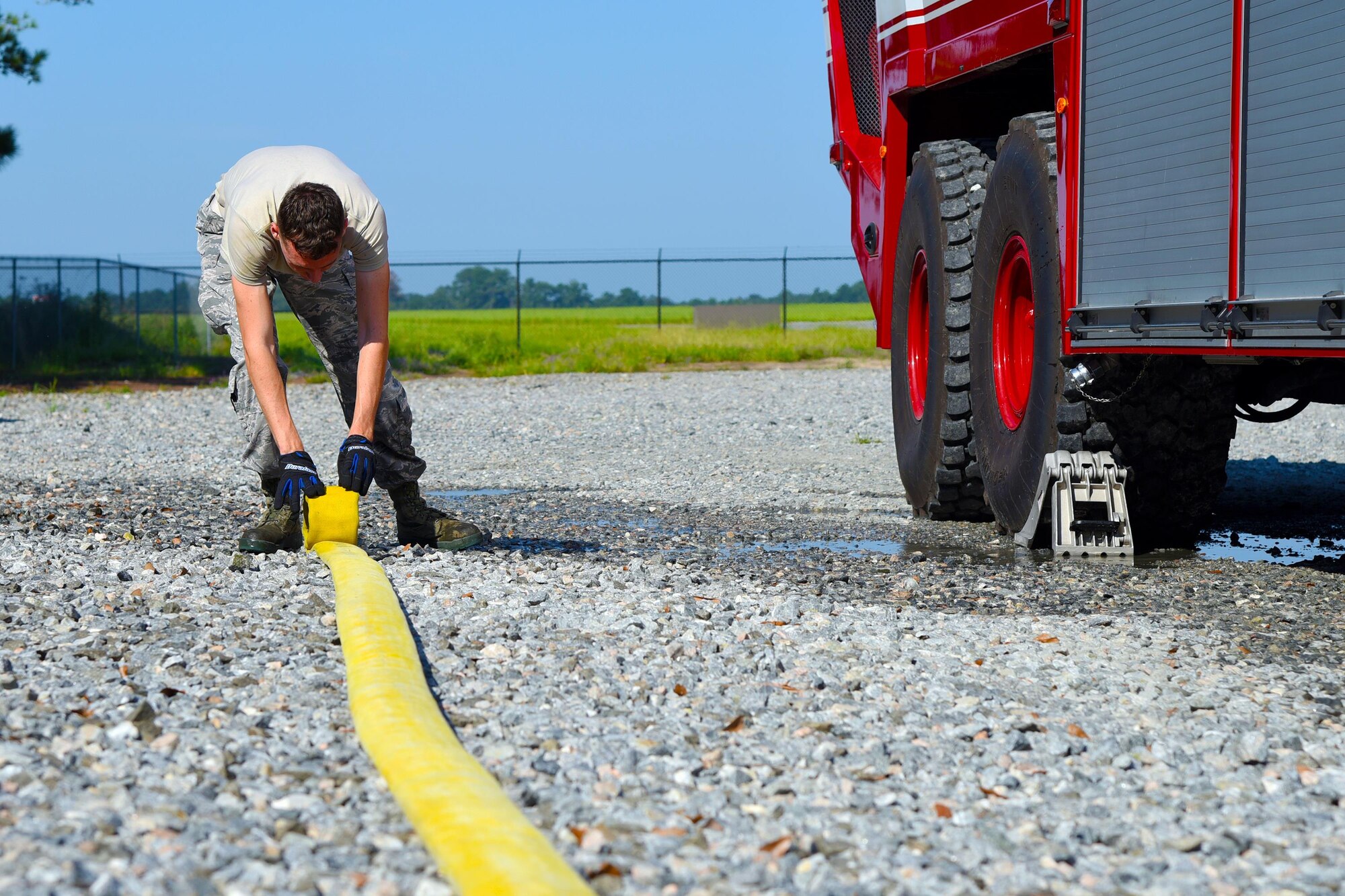 Airman 1st Class Brian Cane, 23d Civil Engineer Squadron firefighter, rolls a fire hose following a training exercise, August 24, 2017, Moody Air force, Ga. The fire station from the 23d CES holds training exercises once a month to sharpen their skills and ensure readiness. (U.S. Air Force photo by Airman Eugene Oliver)