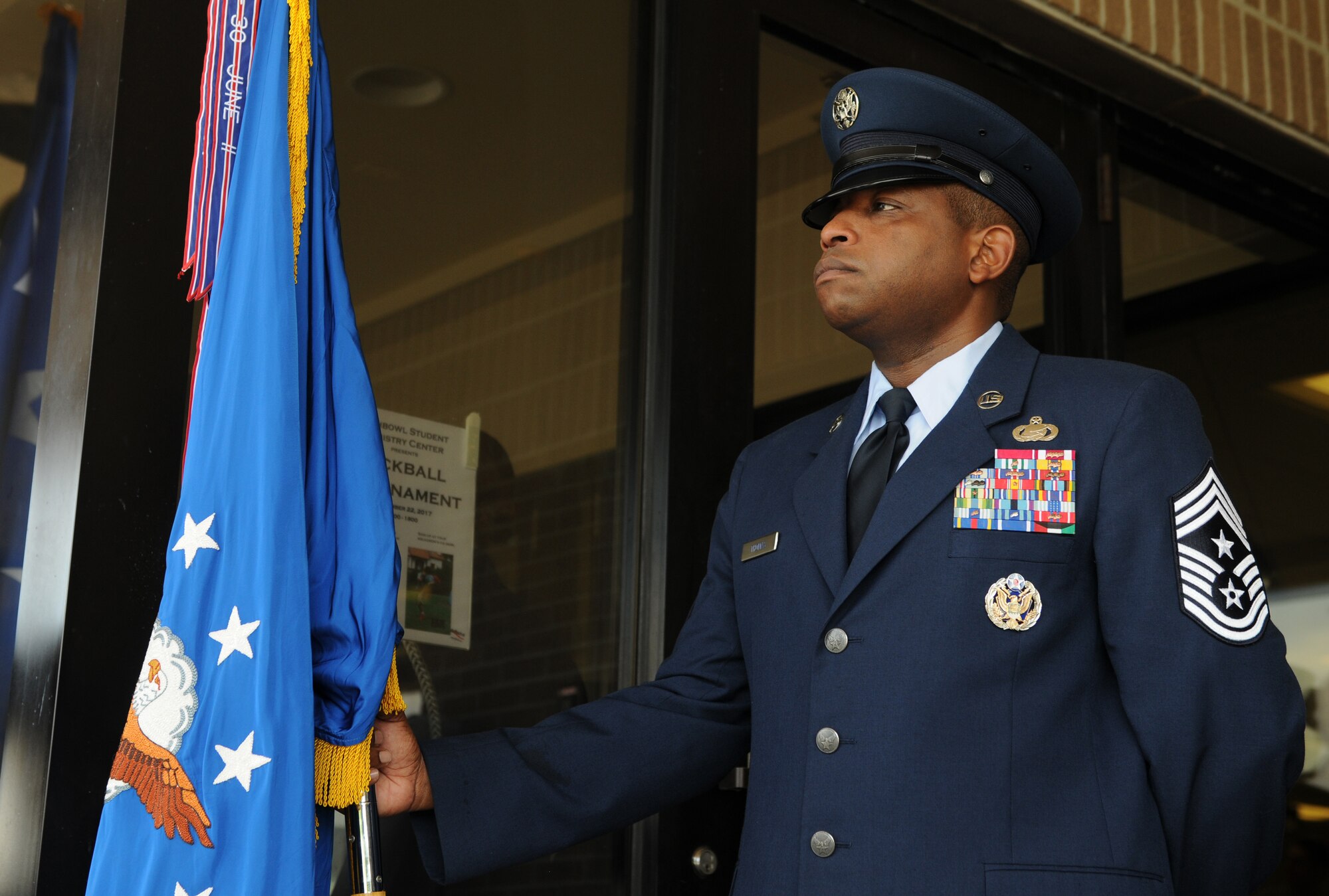 Chief Master Sgt. Farrell Thomas, 2nd Air Force command chief, holds the Air Force flag during the 2nd AF change of command ceremony at the Levitow Training Support Facility Aug. 23, 2017, on Keesler Air Force Base, Miss. Maj. Gen. Timothy Leahy took command of 2nd AF during the ceremony from Maj. Gen. Bob LaBrutta. (U.S. Air Force photo by Senior Airman Holly Mansfield)