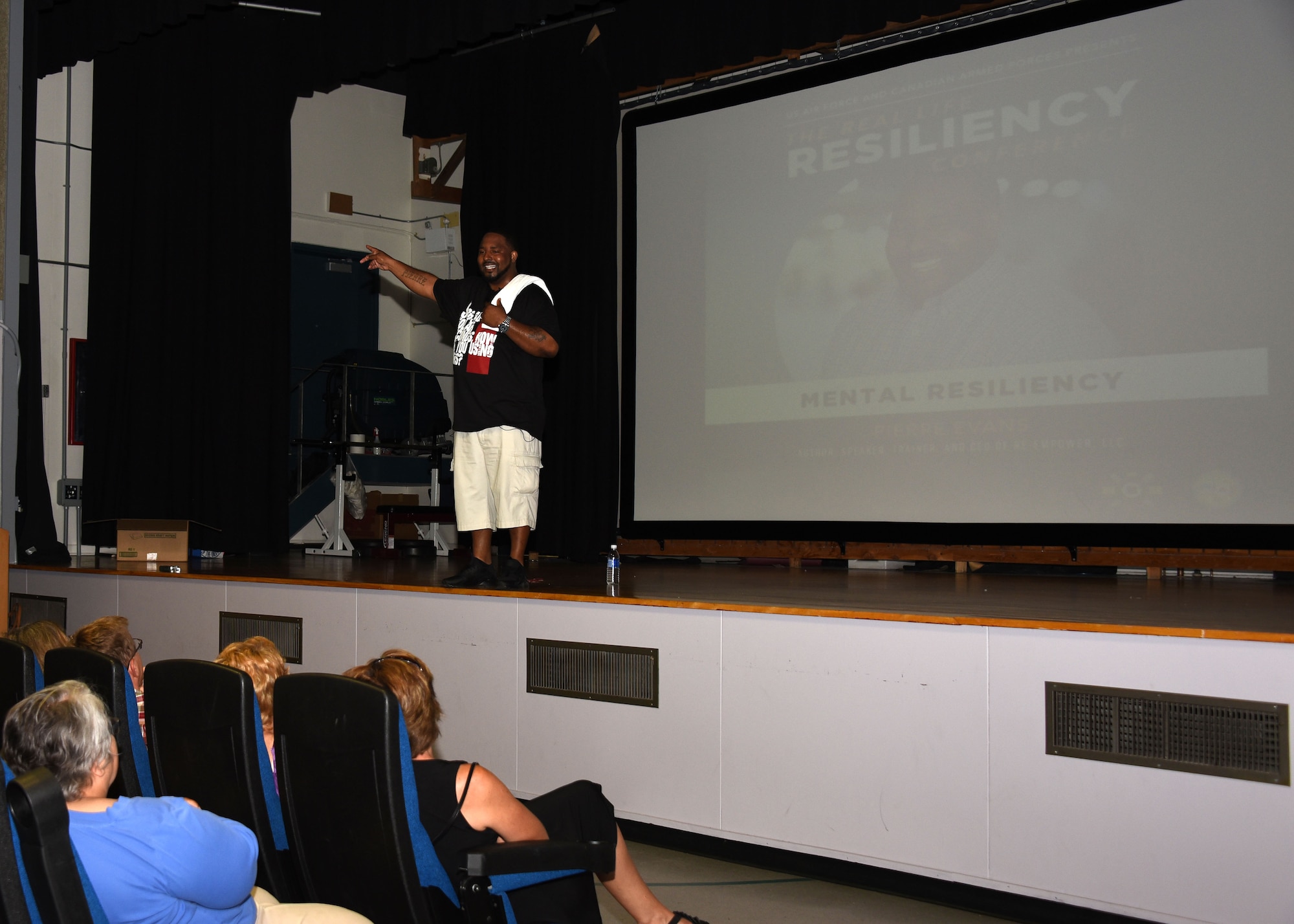 Pierre Evans, a motivational speaker, coach and author, speaks to an audience of civilians, military spouses, Canadian Armed Forces and Airmen from Minot Air Force Base, N.D., and Grand Forks Air Force Base, N.D., Aug. 17, 2017, at a resiliency conference hosted at Canadian Forces Base, Winnipeg, Canada. The conference included four national and international guest speakers who shared their experience and tips for being mentally, spiritually, physically and emotionally resilient. (U.S. Air Force photo by Airman 1st Class Elora J. Martinez)